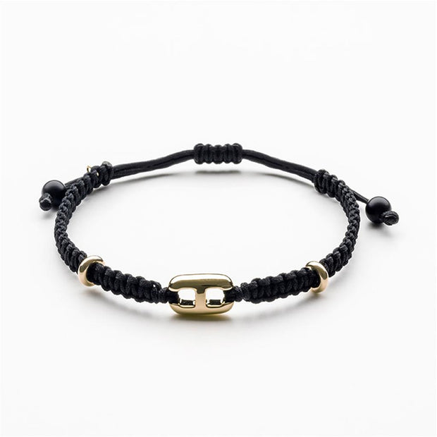 Black cord bracelet with 14k Yellow Gold link.