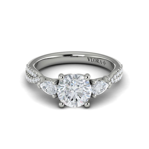 Vlora Bridal Three-Stone Engagement Ring with a Round center stone featuring 0.55 total carats of accent diamonds