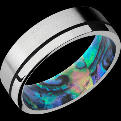 7 mm wide/Flat/14K White Gold band with one 0.5 mm Off Center inlay of Black also featuring a Abalone sleeve.
