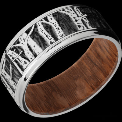 9 mm wide/Flat Grooved Edges/Cobalt Chrome band with a laser carved Aspen pattern also featuring a Leopard Wood sleeve.