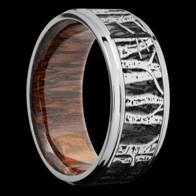 9 mm wide/Flat Grooved Edges/Cobalt Chrome band with a laser carved Aspen pattern also featuring a Leopard Wood sleeve.