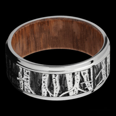 9 mm wide/Flat Grooved Edges/Cobalt Chrome band with a laser carved Aspen pattern also featuring a Leopard Wood sleeve.