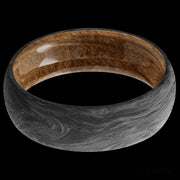 7 mm wide Domed Forged Carbon Fiber band featuring a Whiskey Barrel sleeve.