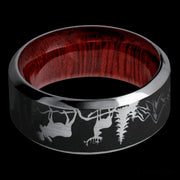 9 mm wide/High Bevel/Tantalum band with a laser carved Bear Moose Deer Mountain pattern also featuring a Blood Wood sleeve.