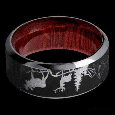 9 mm wide/High Bevel/Tantalum band with a laser carved Bear Moose Deer Mountain pattern also featuring a Blood Wood sleeve.